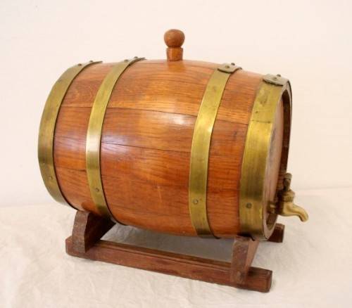 A fabulous small vintage solid Oak wine barrel with its original brass hoops, tap and stand!