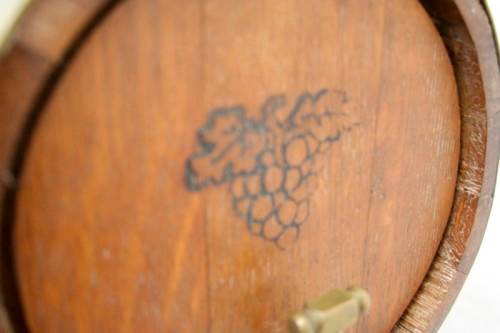 A fabulous small vintage solid Oak wine barrel with its original brass hoops, tap and stand!