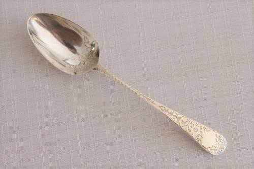A fabulous ornate antique Georgian (1810) British made and hallmarked sterling silver spoon