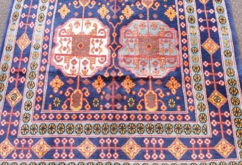 A beautiful and very well made colourful Russian Derbent carpet in light & dark blue, reds and rust