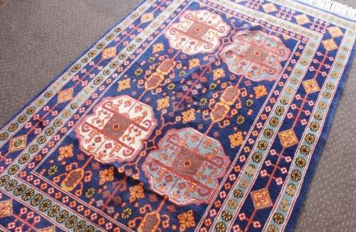 A beautiful and very well made colourful Russian Derbent carpet in light & dark blue, reds and rust