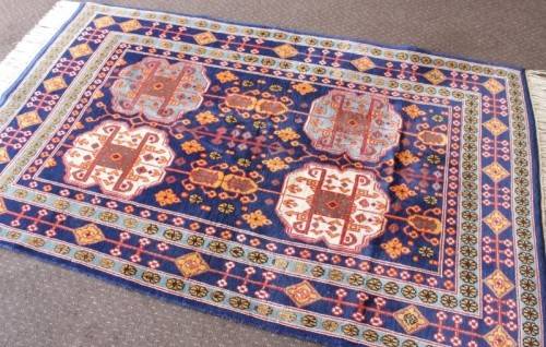 A beautiful and very well made colourful Russian Derbent carpet in light & dark blue, reds and rust