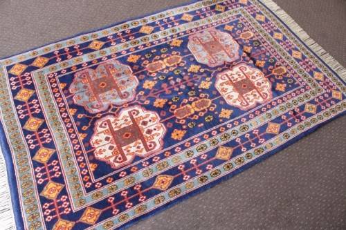 A beautiful and very well made colourful Russian Derbent carpet in light & dark blue, reds and rust