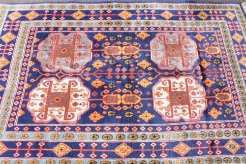 A beautiful and very well made colourful Russian Derbent carpet in light & dark blue, reds and rust