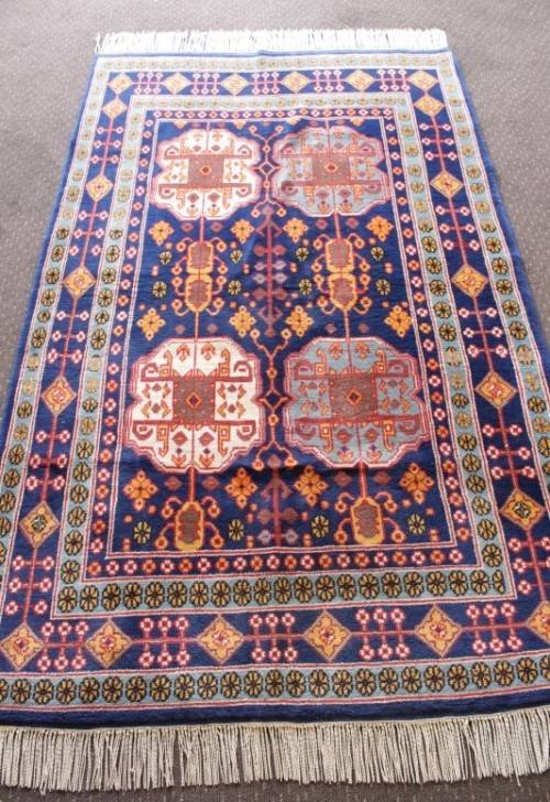 A beautiful and very well made colourful Russian Derbent carpet in light & dark blue, reds and rust