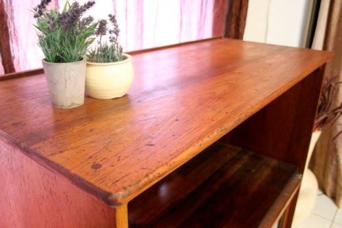 **RS17** A large Teak cabinet w/ fold away serving shelf, glass sliding doors, on original castors