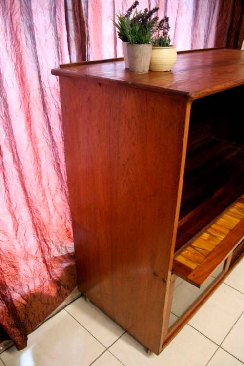 **RS17** A large Teak cabinet w/ fold away serving shelf, glass sliding doors, on original castors