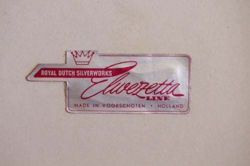 **RS17** A boxed set of Royal Dutch Silverworks "Elwezetta Line" chrome plated spoons & tea strainer