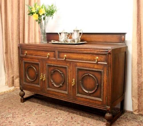 An exquisite vintage Oak side server cabinet with brass handles & loads of drawer & cupboard space