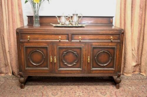 An exquisite vintage Oak side server cabinet with brass handles & loads of drawer & cupboard space
