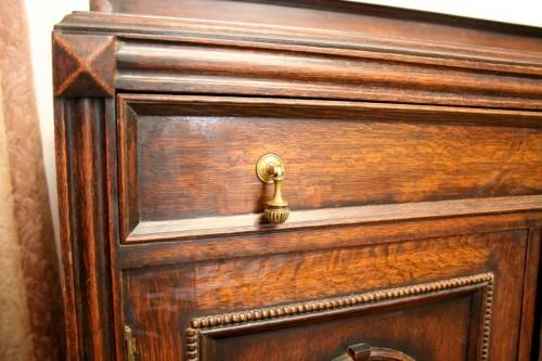 An exquisite vintage Oak side server cabinet with brass handles & loads of drawer & cupboard space