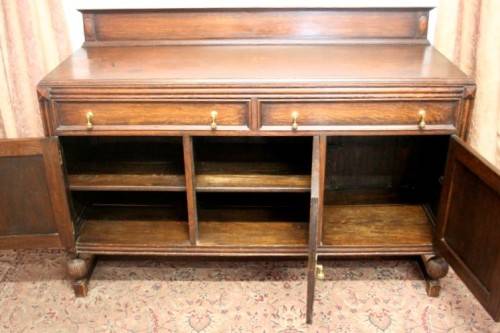 An exquisite vintage Oak side server cabinet with brass handles & loads of drawer & cupboard space