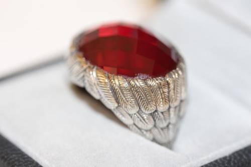 A stunning sterling silver ring with a huge faceted garnet centre stone and exquisite detailing