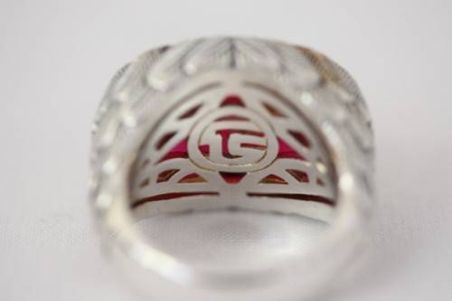 A stunning sterling silver ring with a huge faceted garnet centre stone and exquisite detailing