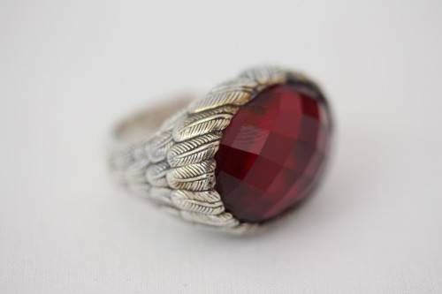 A stunning sterling silver ring with a huge faceted garnet centre stone and exquisite detailing