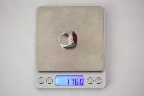 A stunning sterling silver ring with a huge faceted garnet centre stone and exquisite detailing