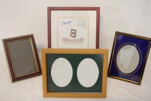 **RS17** Four lovely medium sized assorted free standing photo frames with glass.