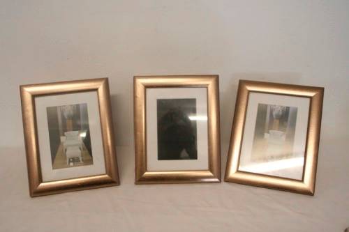 **RS17** Three lovely medium sized bronze coloured free standing photo frames with glass.