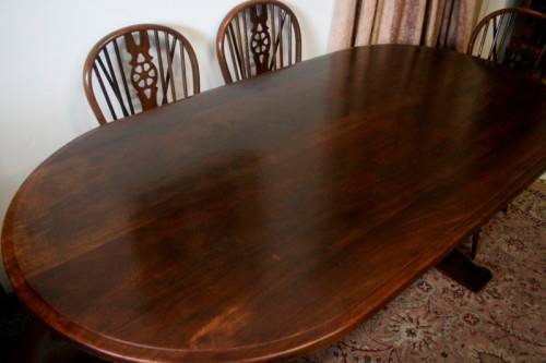 **RS17** A vintage solid Oak 6-seater dining room table with six Brace-back Windsor chairs