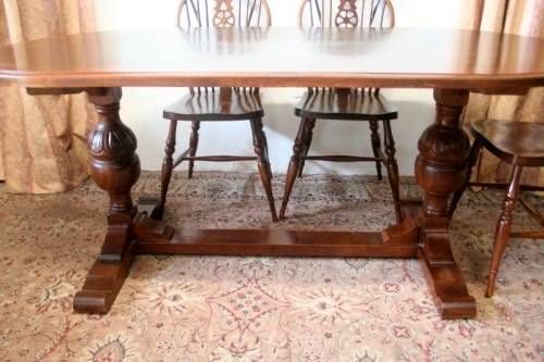 **RS17** A vintage solid Oak 6-seater dining room table with six Brace-back Windsor chairs