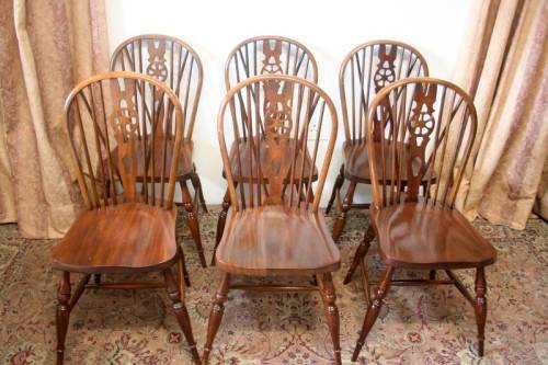 **RS17** A vintage solid Oak 6-seater dining room table with six Brace-back Windsor chairs