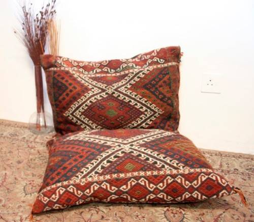 A stunning top-quality colourful hand made Persian camel saddle back double cushion.
