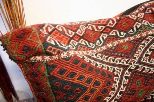 A stunning top-quality colourful hand made Persian camel saddle back double cushion.