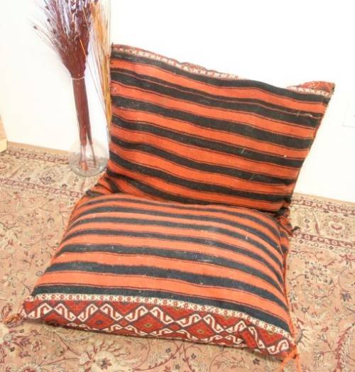 A stunning top-quality colourful hand made Persian camel saddle back double cushion.