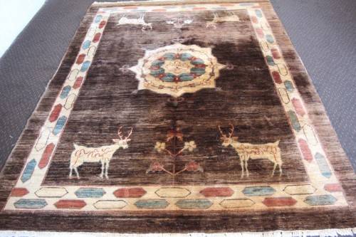 **RS17** A stylish & unusual brown Iranian Meshkin Persian Carpet w/ deer motifs & centre medallion