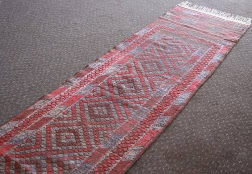 A stunning vintage Persian runner carpet (245cm long) in reds and grey in good condition