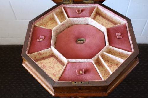 **RS17** An antique (c1890's) Victorian walnut octagonal sewing table w/ an array of compartments