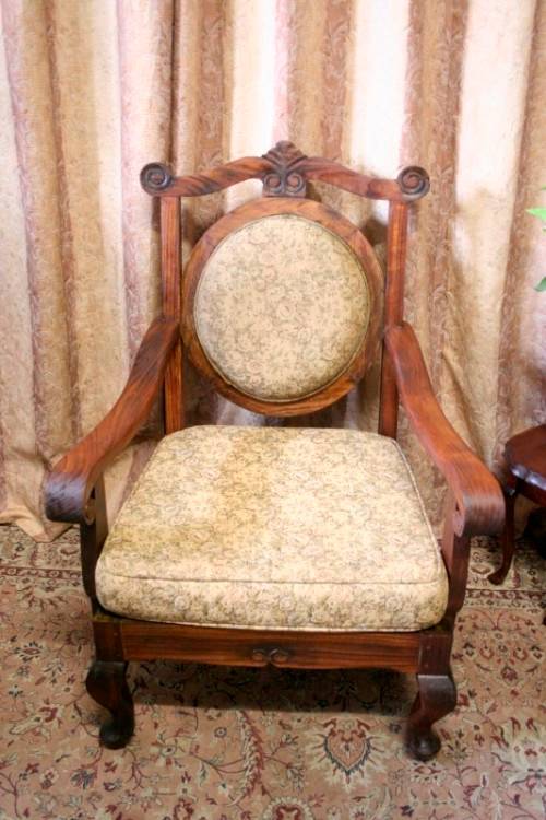 Two gorgeous antique Victorian Stinkwood arm chairs w carved detailing & floral upholstery. Price/