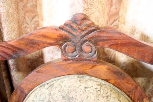 Two gorgeous antique Victorian Stinkwood arm chairs w carved detailing & floral upholstery. Price/