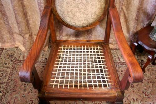 Two gorgeous antique Victorian Stinkwood arm chairs w carved detailing & floral upholstery. Price/