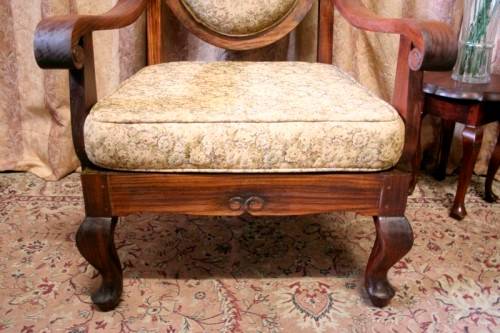 Two gorgeous antique Victorian Stinkwood arm chairs w carved detailing & floral upholstery. Price/