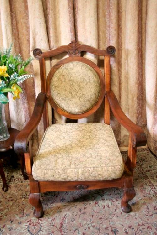 Two gorgeous antique Victorian Stinkwood arm chairs w carved detailing & floral upholstery. Price/