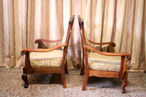 Two gorgeous antique Victorian Stinkwood arm chairs w carved detailing & floral upholstery. Price/