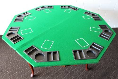 **RS17** A felt-lined folding poker table with built in chip racks and drink holders, in a carry bag