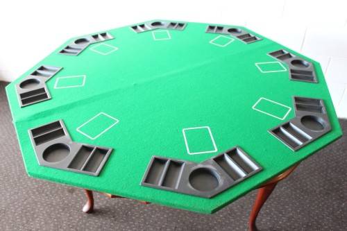 **RS17** A felt-lined folding poker table with built in chip racks and drink holders, in a carry bag