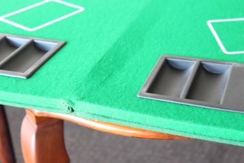**RS17** A felt-lined folding poker table with built in chip racks and drink holders, in a carry bag