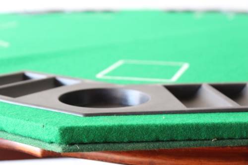 **RS17** A felt-lined folding poker table with built in chip racks and drink holders, in a carry bag