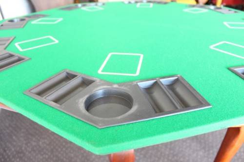 **RS17** A felt-lined folding poker table with built in chip racks and drink holders, in a carry bag