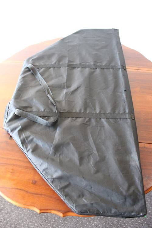 **RS17** A felt-lined folding poker table with built in chip racks and drink holders, in a carry bag