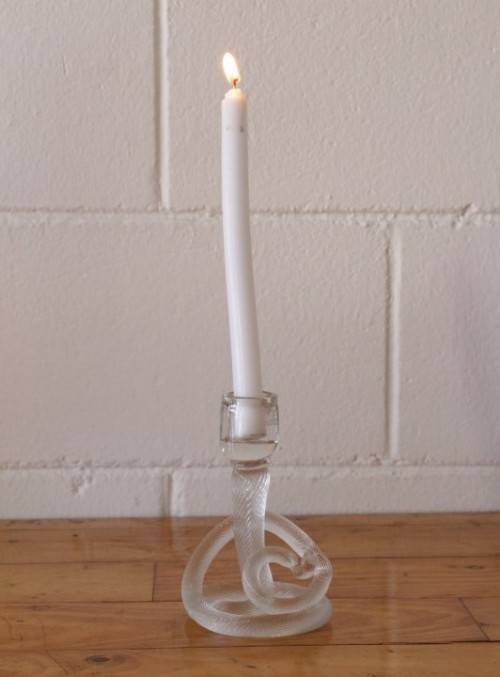 A stunning & very unusual hand blown glass single-candle candle stick w/ an incredible twirled base