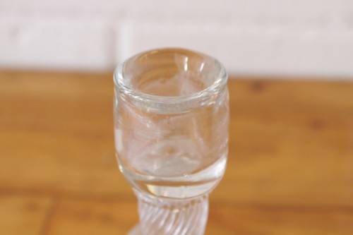 A stunning & very unusual hand blown glass single-candle candle stick w/ an incredible twirled base