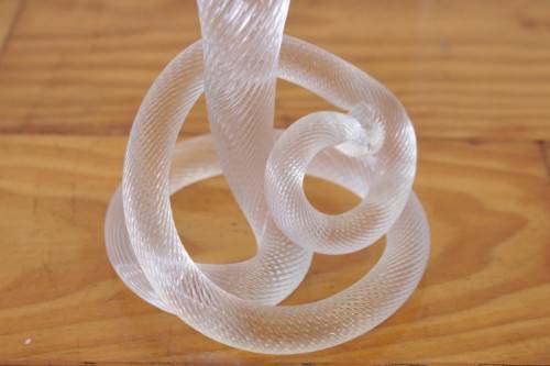 A stunning & very unusual hand blown glass single-candle candle stick w/ an incredible twirled base