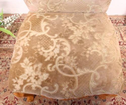 **RS17** A gorgeous Victorian "parlour chair" with carved detailing and floral upholstery.