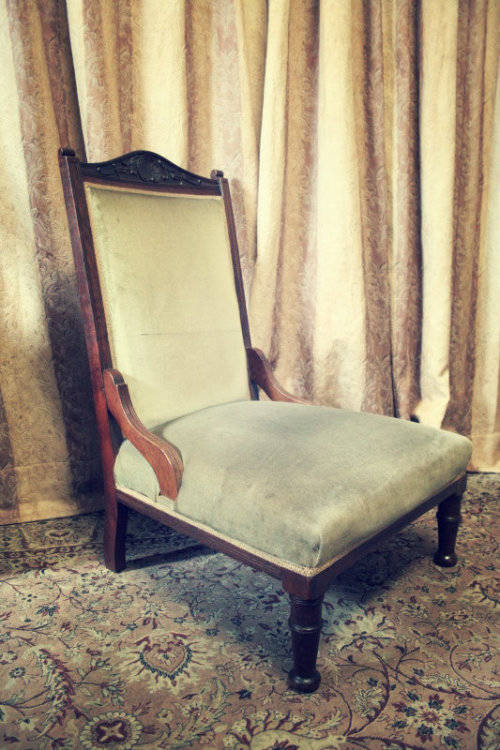**RS17** A hand-carved antique Victorian slipper/ nursing chair upholstered in a soft green fabric