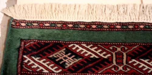 **RS17** A superb (189cm x 289cm long) rare green and red Kashmir Mori Bukhara Persian carpet