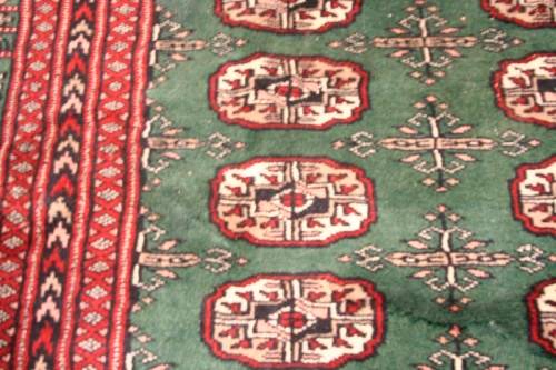 **RS17** A superb (189cm x 289cm long) rare green and red Kashmir Mori Bukhara Persian carpet